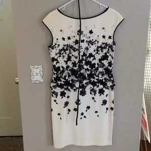 Classic black and white peplum dress with belt.